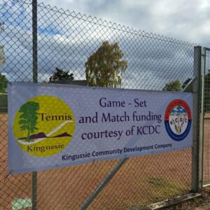 Kingussie Tennis Club banner showing funding provided by KCDC to deliver a project.